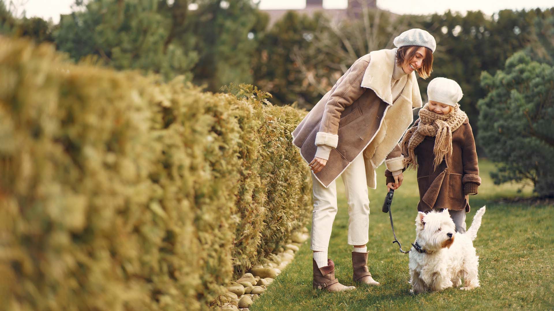 mom-daughter-walking-with-dog-in-garden mortgage-advice-insurance-spratt-financial